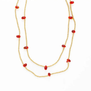 Necklace with red beads on a white background