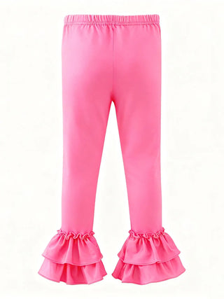Pink leggings with ruffled bottom on a white background