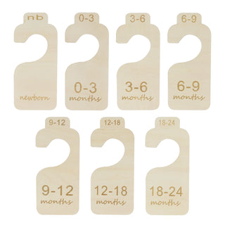 Set of baby clothing size dividers with age markings on a white background