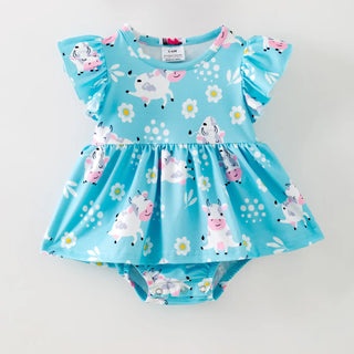 Blue romper with cow print on white background