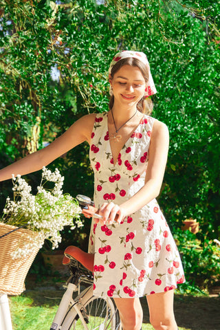 Sun Dress with Cherries print and deep V neck. Sleeveless and Short length.