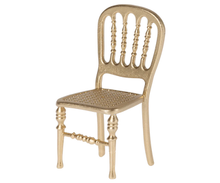 Gold metal chair with a white background