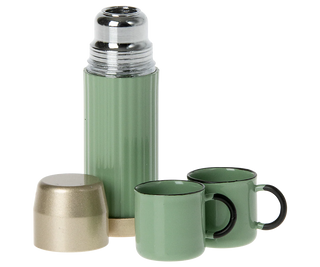 Green thermos with two matching mugs on a white background
