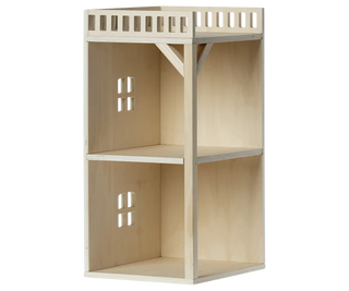 A light natural wood dollhouse-style shelving unit with two upper bays, each featuring a window cutout and a slatted guard rail at the top, and two lower open bays with shelf dividers.