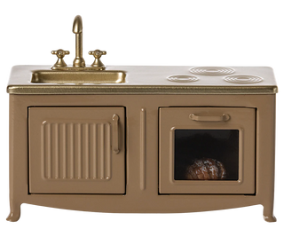 Vintage-style kitchen sink with stove and oven combination on a white background