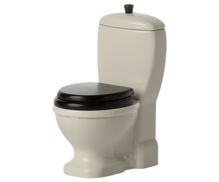 Beige toilet with black seat on a white background