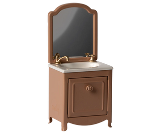 Brown bathroom vanity with mirror and sink on a white background