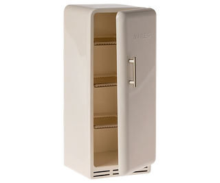 Beige refrigerator with open door on a white background
