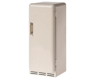 Beige refrigerator on a white background