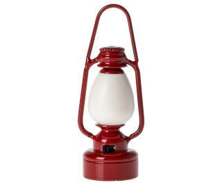 Red lantern with a white glass cover on a white background
