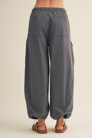Gray wide-leg pants on a neutral background