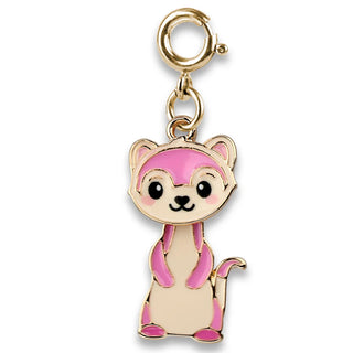 Gold charm with pink and beige design on a white background