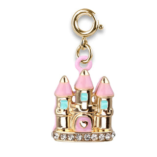A gold-plated castle charm with pink enamel towers, light blue enamel windows, a pink heart-shaped door, and a base lined with clear rhinestones, attached to a gold lobster clasp on a white background.