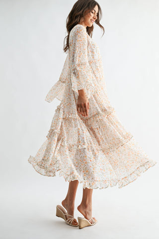 Woman wearing a floral lace dress on a white background