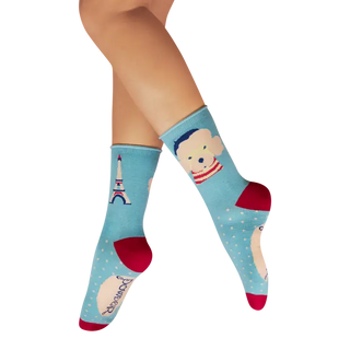Light blue socks with cartoon character design on a white background