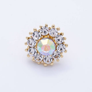 Gold and crystal brooch on a white background