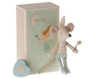 Stuffed mouse toy with a tooth fairy box on a white background