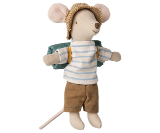 Toy mouse dressed in a striped shirt, shorts, and hat on a white background