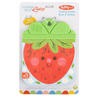 Packaging of a strawberry-shaped book and teether with Tuffy and Cottage Door Baby branding.