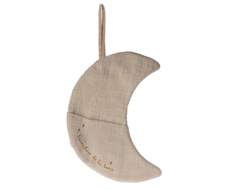 Beige crescent moon-shaped pillow with 'Nanette de la Rose' embroidery on a white background