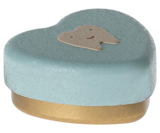 Heart-shaped blue box with a dog face on a white background