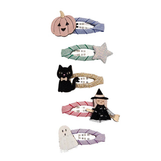 Five Halloween-themed hair clips arranged vertically on a plain white background. The clips feature designs of a pumpkin, a glittery star, a black cat, a witch, and a ghost.