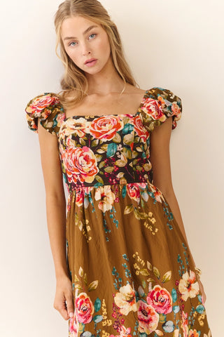 Woman wearing a floral dress with a plain background