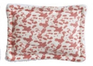 Rectangular sponge with red floral pattern on a white background
