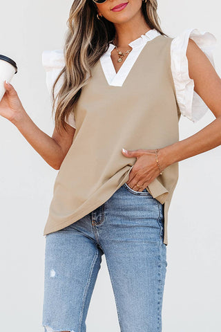 Beige top with V neck and short ruffle sleeve. Hits below hips. 