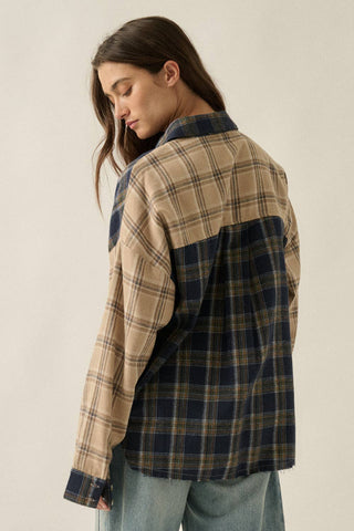 Woman wearing a plaid shirt with a neutral background