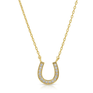 Gold horseshoe necklace with diamonds on a white background
