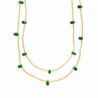 Necklace with green beads on a white background