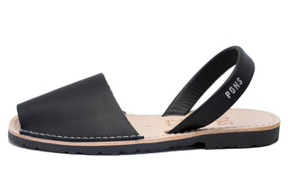 Black sandal with a strap on a white background