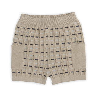 Beige shorts with black pattern on a white background
