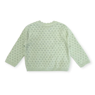 Light green knitted cardigan on a white background