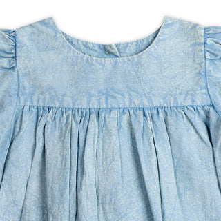 Light blue denim dress with ruffled sleeves on a white background
