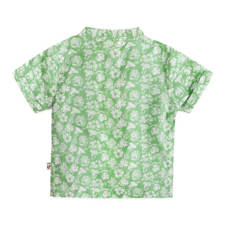Green shirt with white floral pattern on a white background
