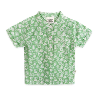 Green shirt with white floral pattern on a white background