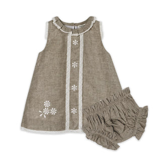 Children's outfit with a sleeveless top and bloomers on a white background