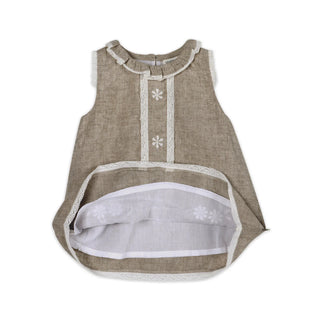 Beige sleeveless top with white trim on a white background