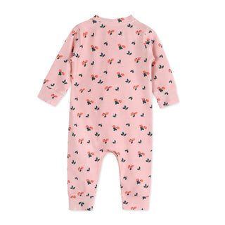 Pink baby onesie with floral pattern on a white background