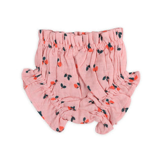 Pink baby bloomers with cherry pattern on a white background