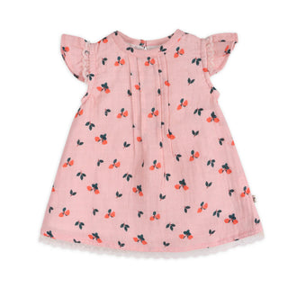 Pink dress with cherry pattern on a white background