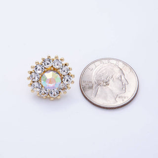 Gold and silver decorative brooch next to a quarter on a white background