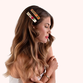 Woman with floral hair clip on a white background