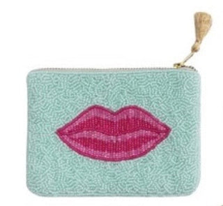 Beaded pouch with pink lips design on a light blue background