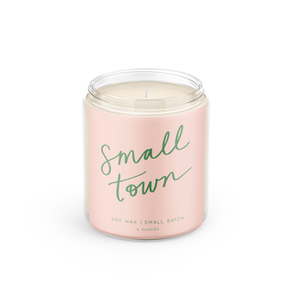 Candle in a pink jar with 'Small Town' text on a white background