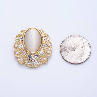 Decorative brooch with gemstones and pearls next to a quarter for scale on a light purple background