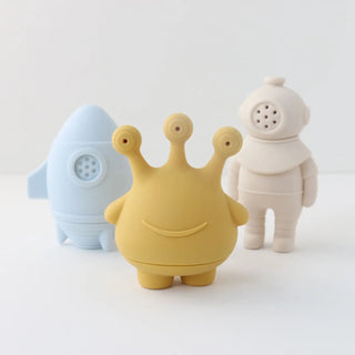 Three colorful toy figures on a white background
