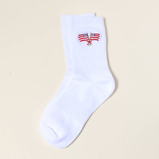 White sock with a small flag design on a beige background
